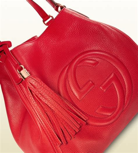 red gucci bag with tassel|Gucci double g shoulder bag.